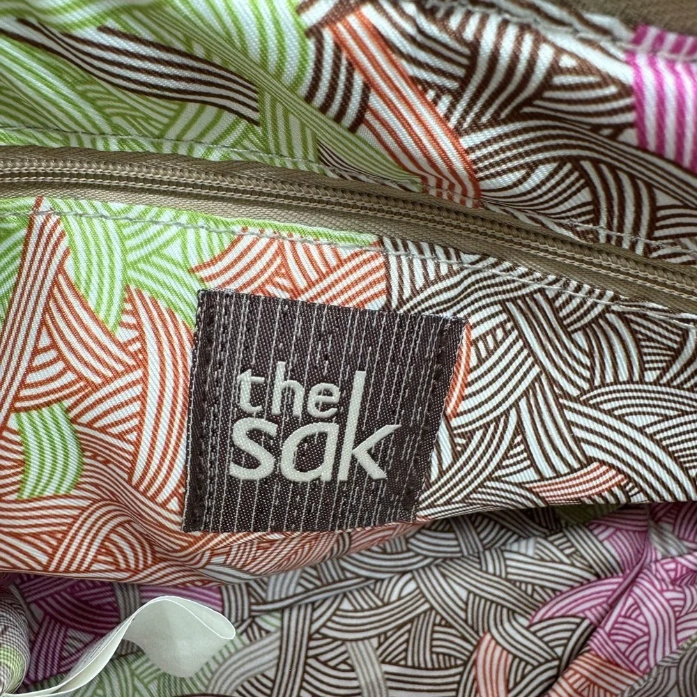 The Sak Tan Indio Leather Shoulder Bag with silver metallic panel